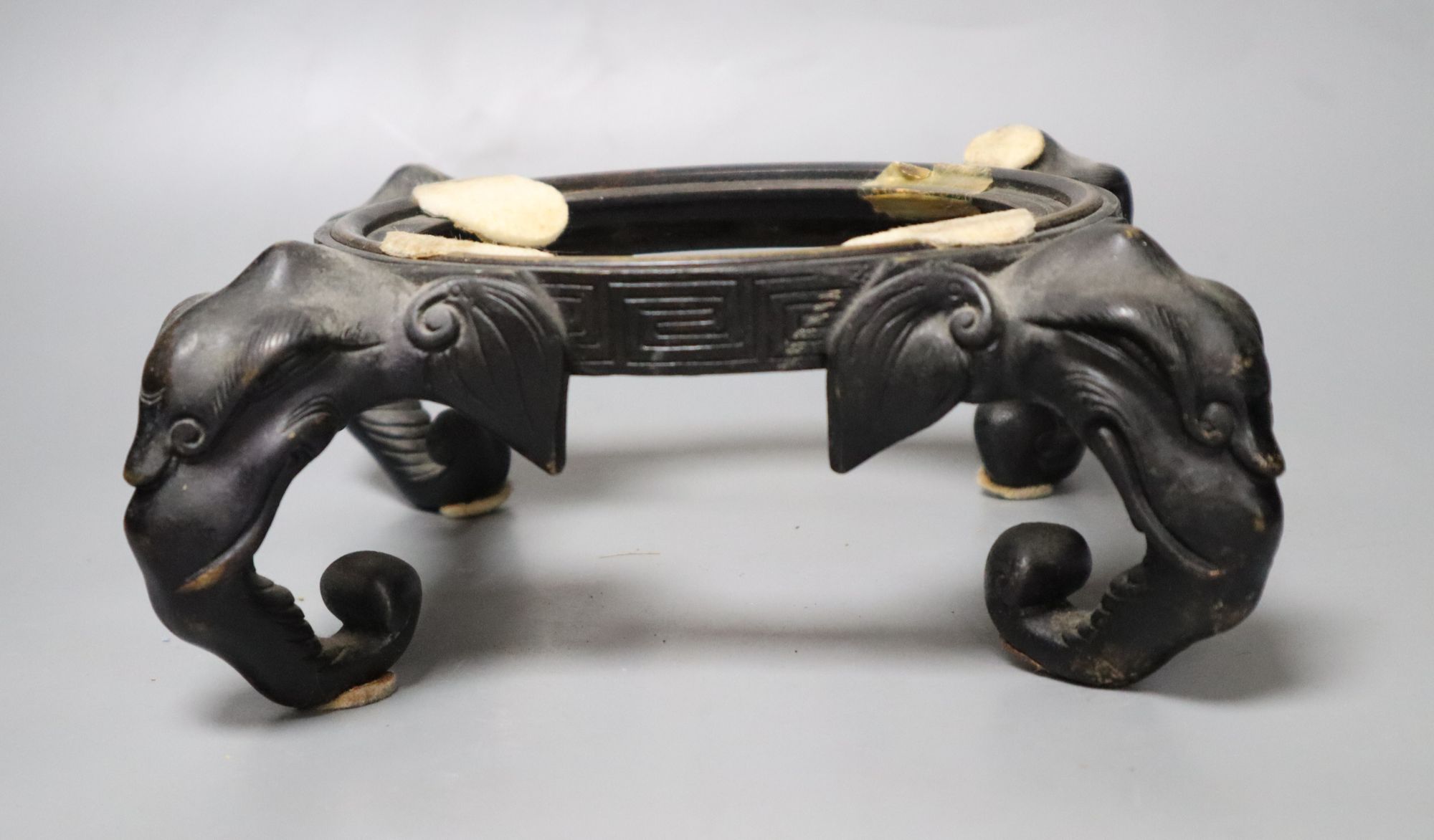 A Chinese bronze elephant head stand, length 30cm